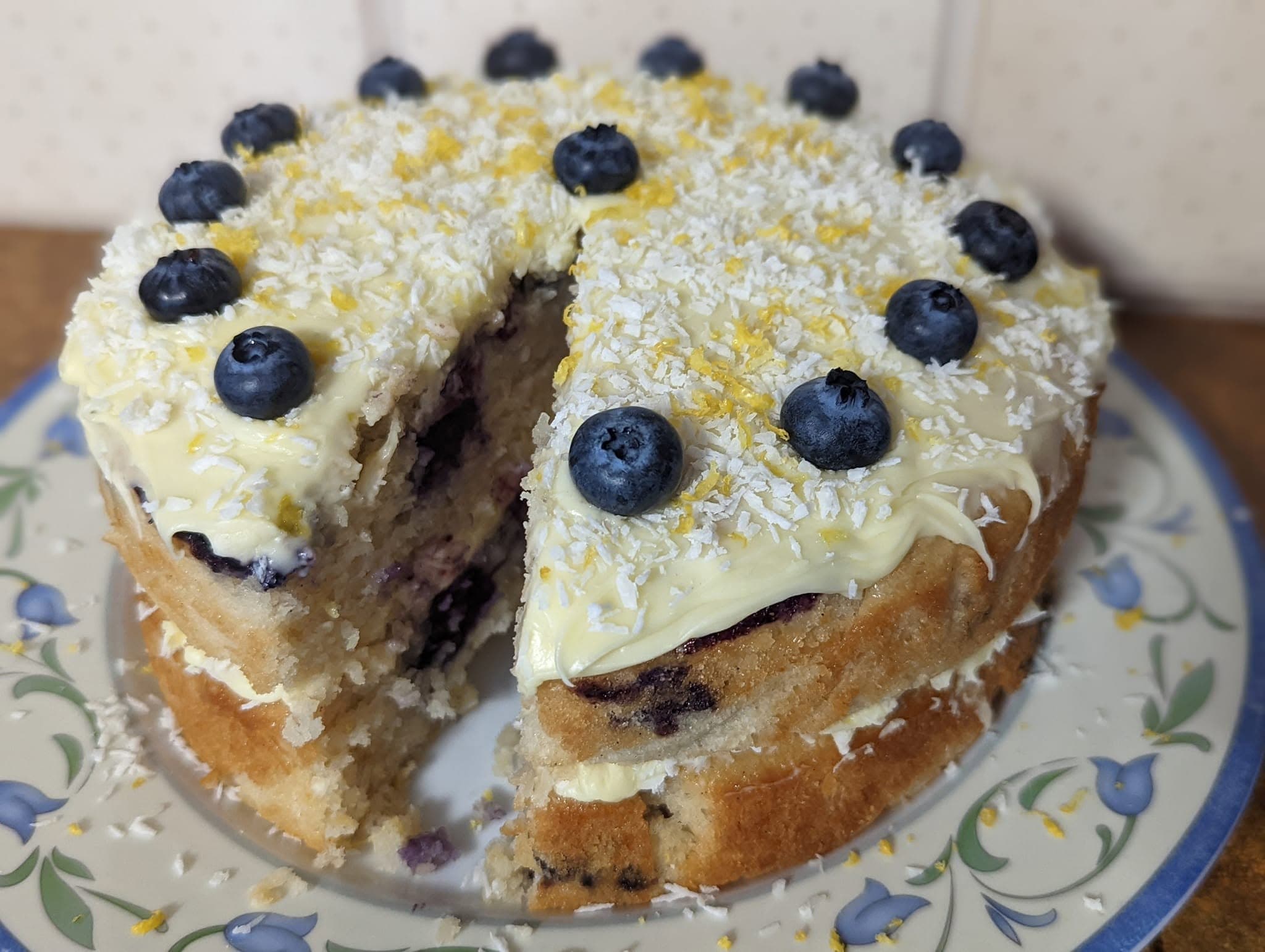 Lemon, coconut and blueberry cake topped with fresh blueberries